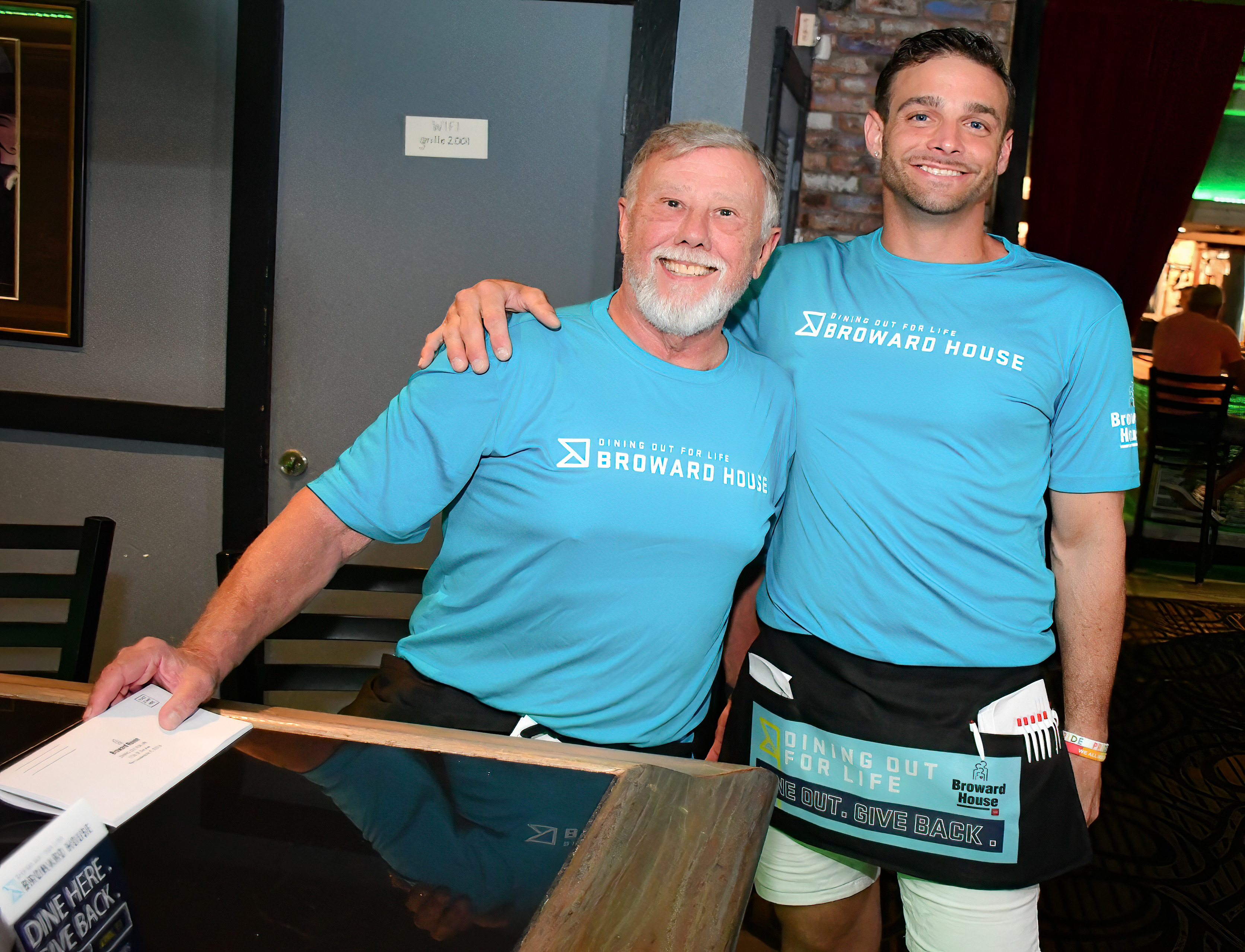 Volunteers participating in a Broward House community event